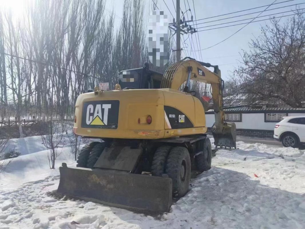 কাজ করার জন্য প্রস্তুত Caterpillar M315D কম কাজের ঘন্টা এবং ভাল অবস্থায় ব্যবহৃত চাকা খননকারী
